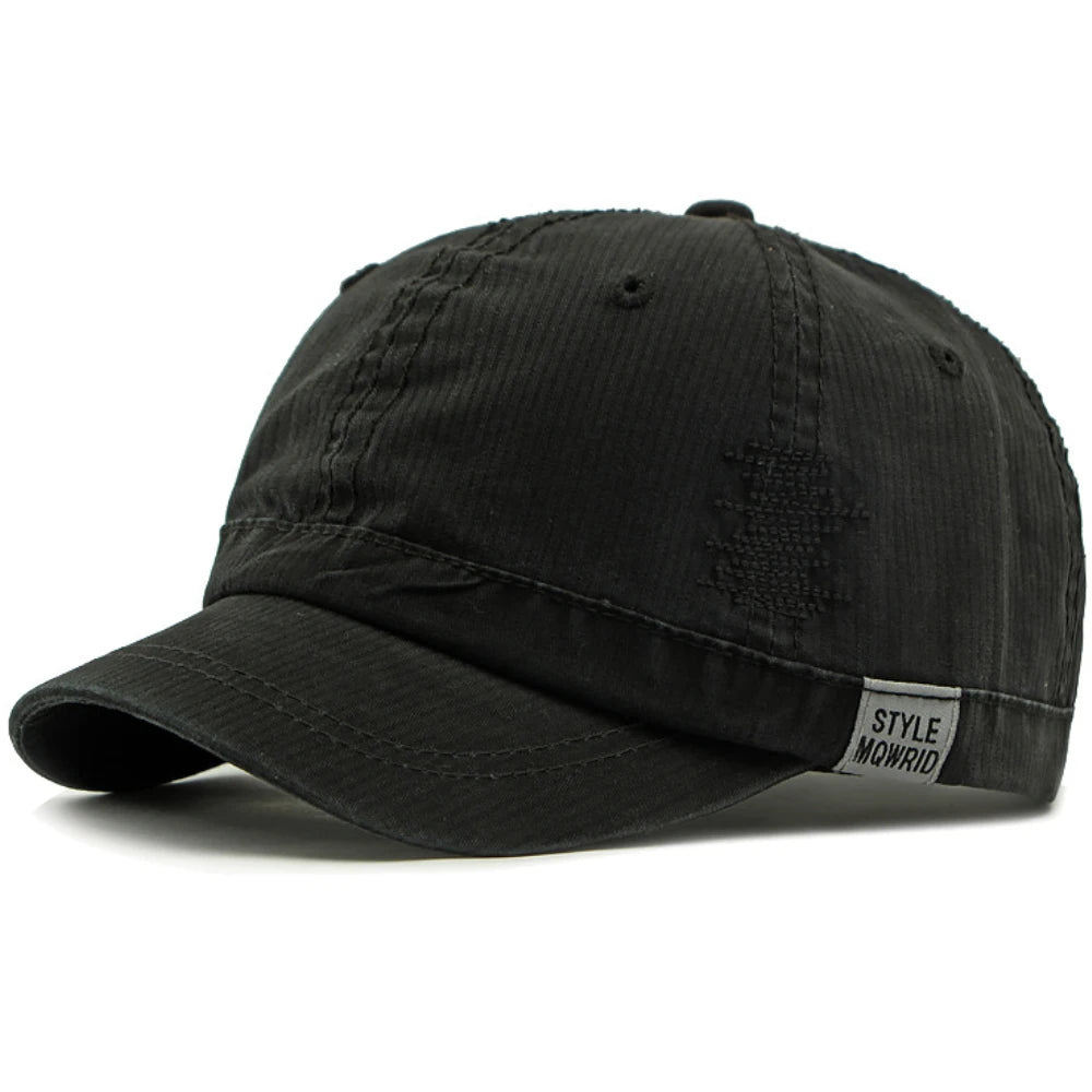 Black Short brim baseball cap worn on model — side