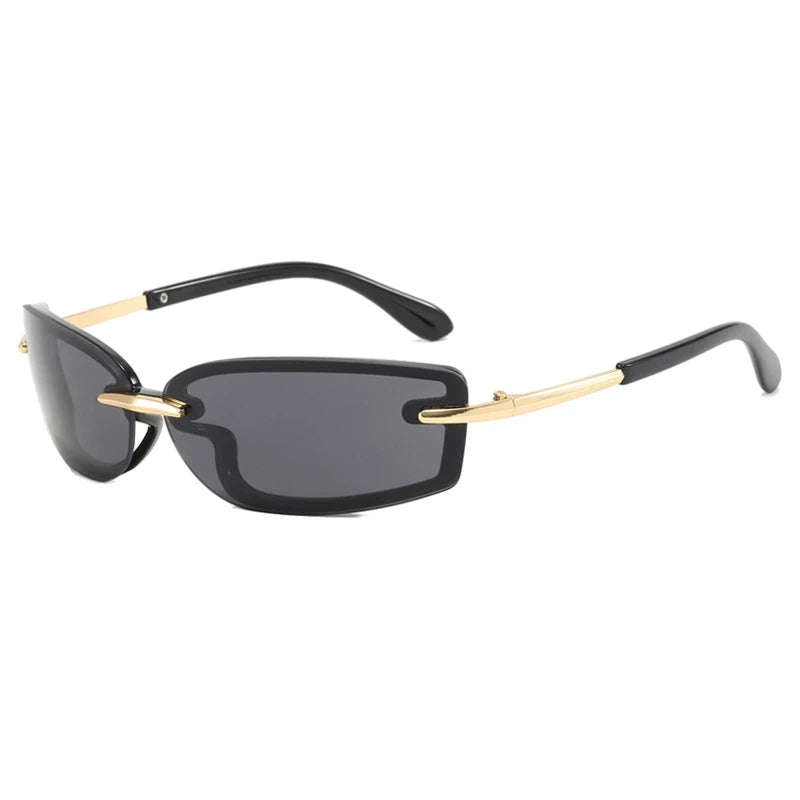 Sunglasses with black lenses and gold frames on a white background
