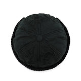 Black textured round pillow on a white background