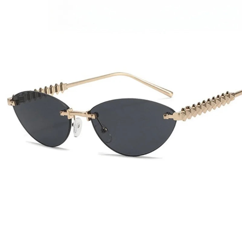 Sunglasses with gold frame and black lenses on a white background