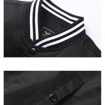 Black jacket with white trim and buttons on a white background