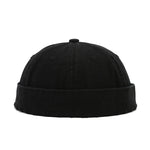 Black beanie hat on a white background
