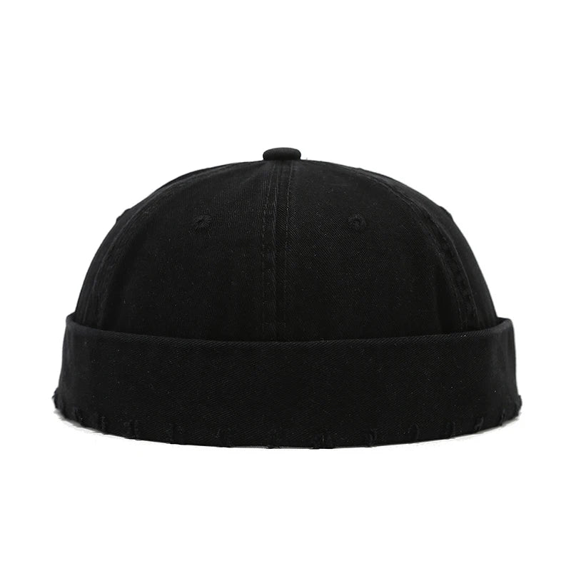 Black beanie hat on a white background