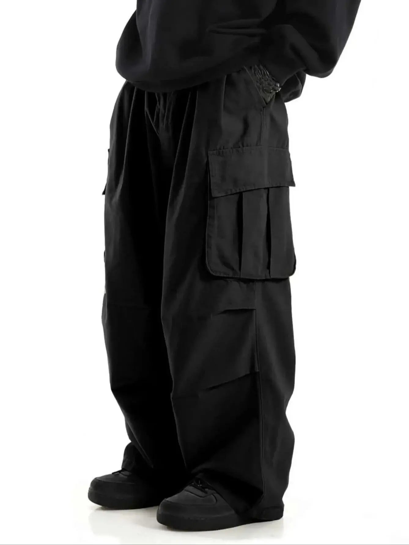 Black Wide-leg cargo pants, close-up on model