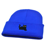 Blue beanie with a black cat embroidery on a white background