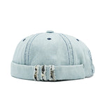 Light blue denim cap with distressed details on a white background