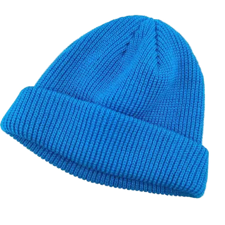 Blue knit beanie on a light gray background