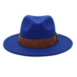 Blue Panama fedora hat front view showing wide brim and tooled leather band with metal studs
