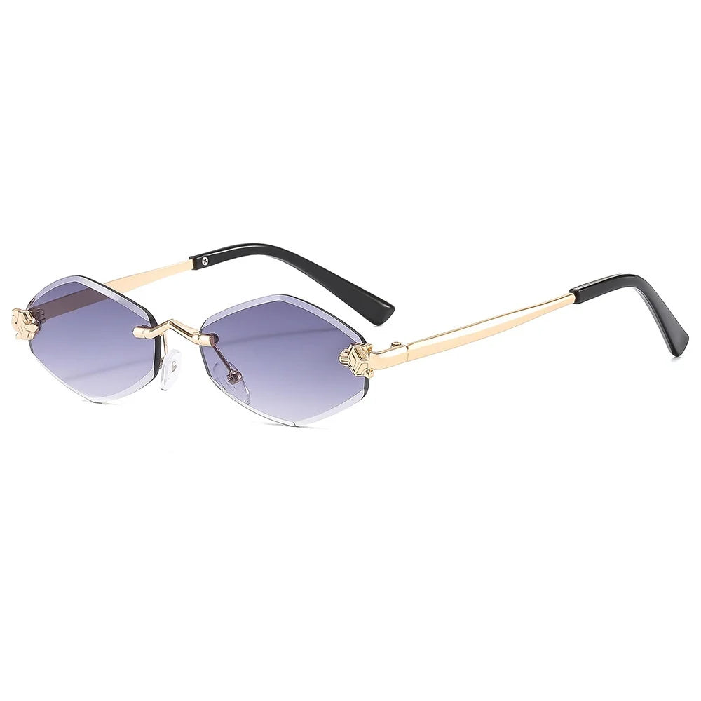 Sunglasses with gold frame and black arms on a white background