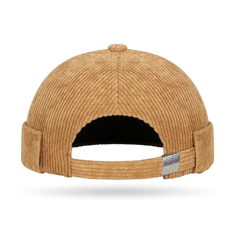 Brimless corduroy docker cap, angled view showing texture