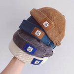 Brimless corduroy docker cap, side profile view
