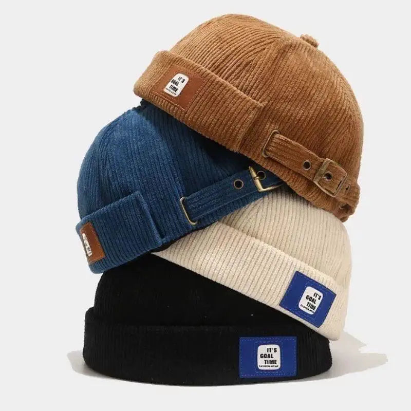 Brimless corduroy docker cap worn on model, front view