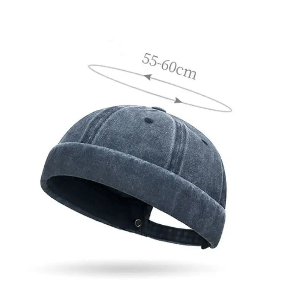 Blue denim cap with size measurement on a white background