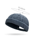Blue denim cap with size measurement on a white background