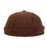 Brown Model wearing brimless docker hat, side view