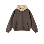 Brown hoodie with beige hood on a light gray background