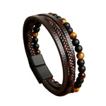 Brown Beads Beaded leather layered bracelet shown at an angle highlighting tiger eye beads and braided strands