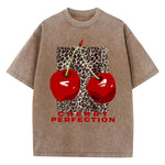Brown Graphic tee flat lay showing cherry perfection print with leopard panel on vintage wash fabric