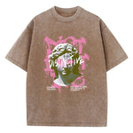 Brown Flat lay of oversized cotton graphic tee showing print and drop-shoulder cut