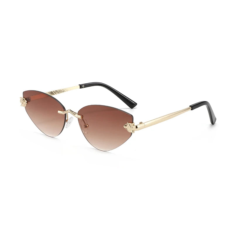 Sunglasses with gold frame and brown gradient lenses on a white background