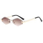 Sunglasses with gold frame and black arms on a white background