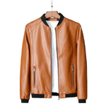 Brown leather jacket on a hanger against a dark background