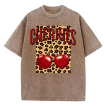 Brown-Xy379 Cherry leopard print graphic tee flat lay, full garment