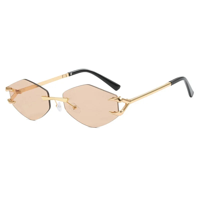 Gold-rimmed sunglasses with black arms on a white background