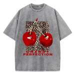 Cherry and leopard print graphic tee on model, close-up crop