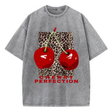 Cherry and leopard print graphic tee on model, close-up crop