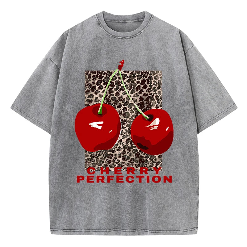 Cherry and leopard print graphic tee on model, close-up crop