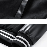 Close-up of a black jacket with a zipper and striped cuffs on a white background.