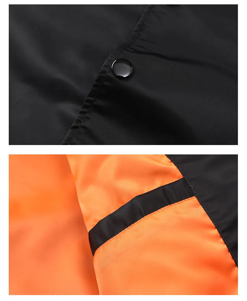 Close-up of black button on black fabric and orange fabric with black strip.