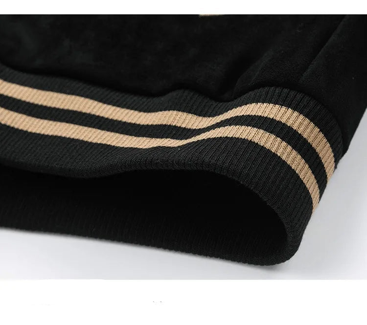 Close-up of black fabric with beige stripes on a white background