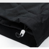 Close-up of a black jacket with a zipper on a white background
