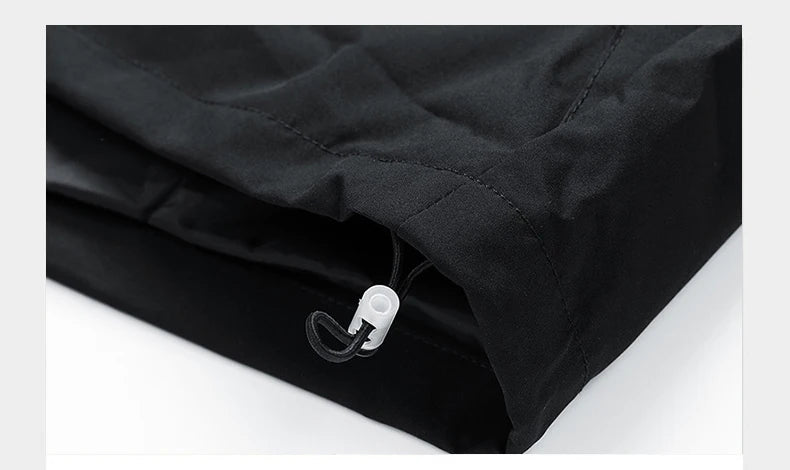 Close-up of a black jacket with a zipper on a white background