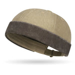 Beige cap with brown band on a white background