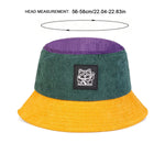 Bucket hat with green top and yellow bottom on a white background