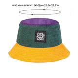 Bucket hat with green top and yellow bottom on a white background