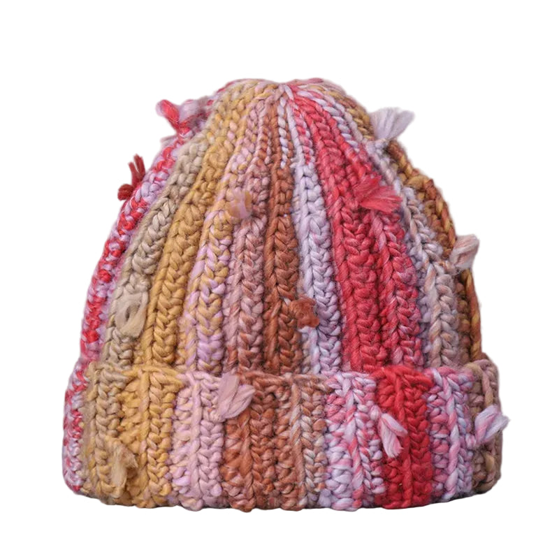 Multicolored knitted hat on a gray background