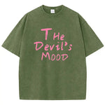 Dark green Devil's Mood washed oversized graphic tee — side view showing long hem and drop shoulder