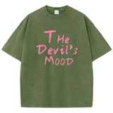 Dark green Devil's Mood washed oversized graphic tee — side view showing long hem and drop shoulder