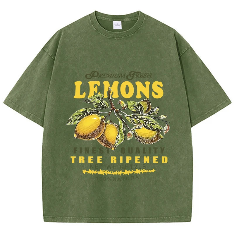 Dark green lemon graphic tee on model, cropped lifestyle shot showing fit