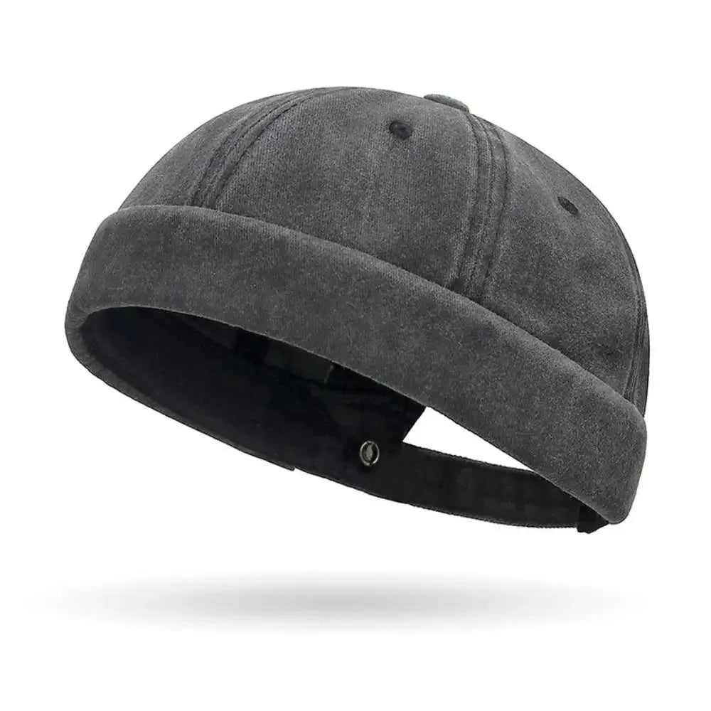 Dark gray beanie hat on a white background