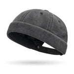 Dark gray beanie hat on a white background