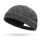 Dark gray beanie hat on a white background