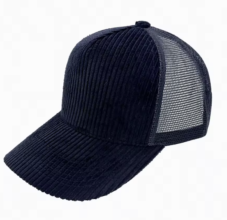 A dark navy blue trucker cap featuring a ribbed corduroy front and brim, with a matching mesh back.