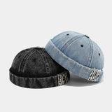 Distressed denim docker cap, angled view
