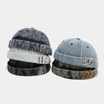 Distressed denim docker cap, front view