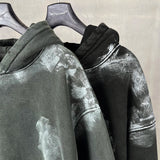 Distressed graffiti baggy hoodie, worn front view